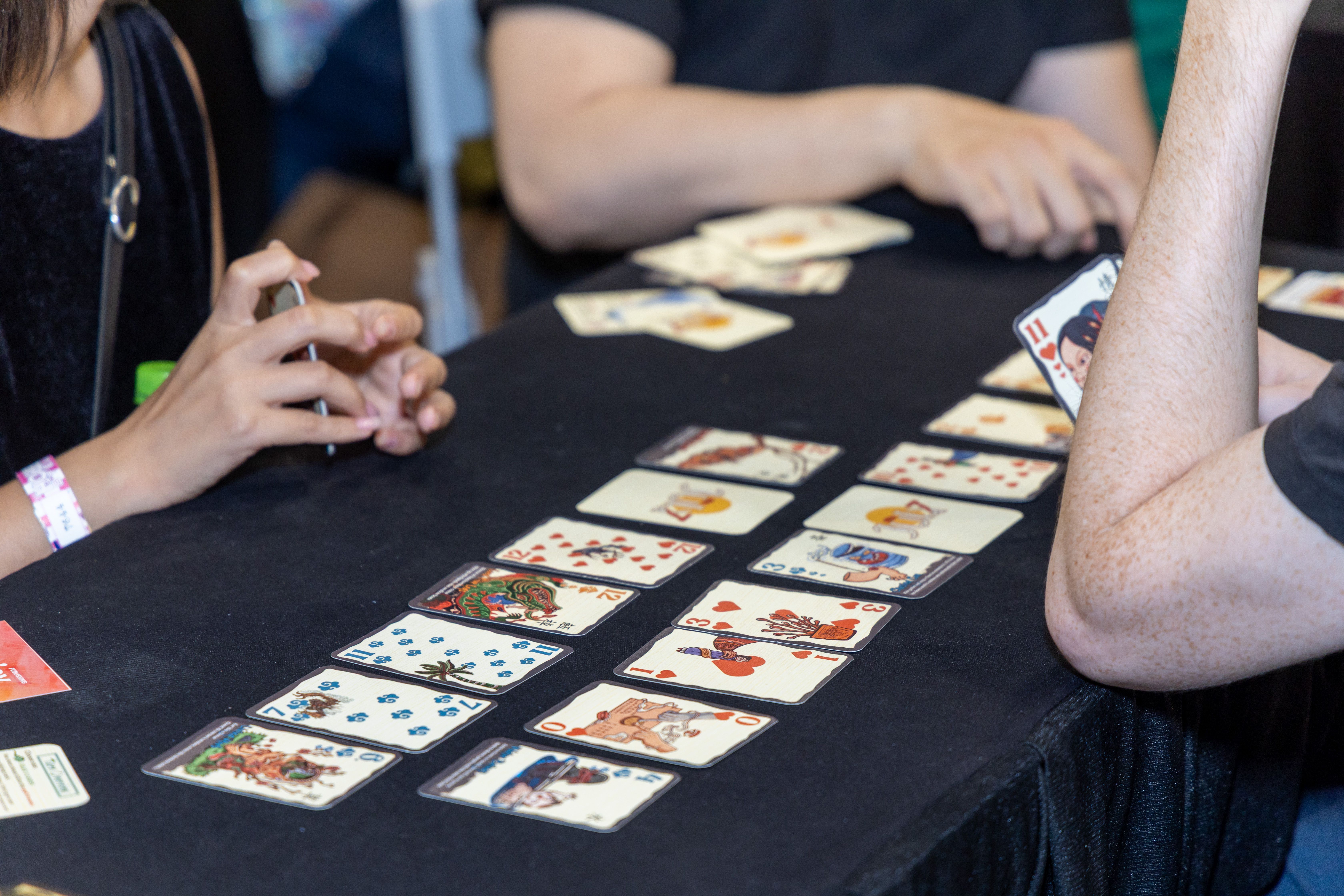 People are playing a card game.